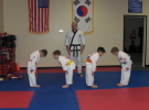 Children learn traditional martial arts values such as discipline and respect, Feb 2008